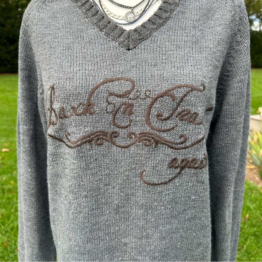 Acrylic v neck sweater with words “ Back on track again” size large